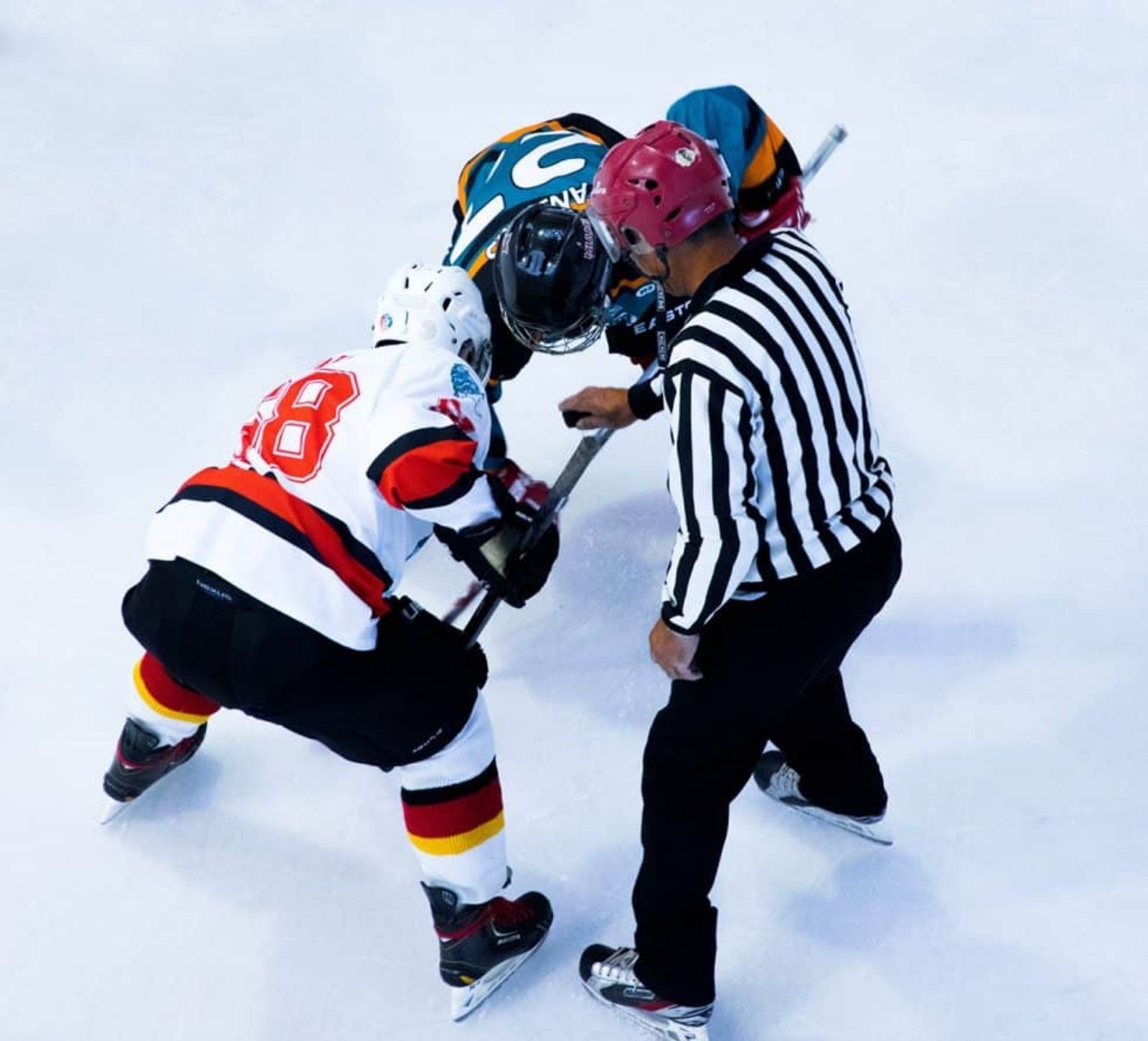 Kitchen Table CEOs blog - Do You Let Your Kids Make Mistakes? Managing Kids, a Household and a Business Working from Home - kids facing off in hockey with a referree