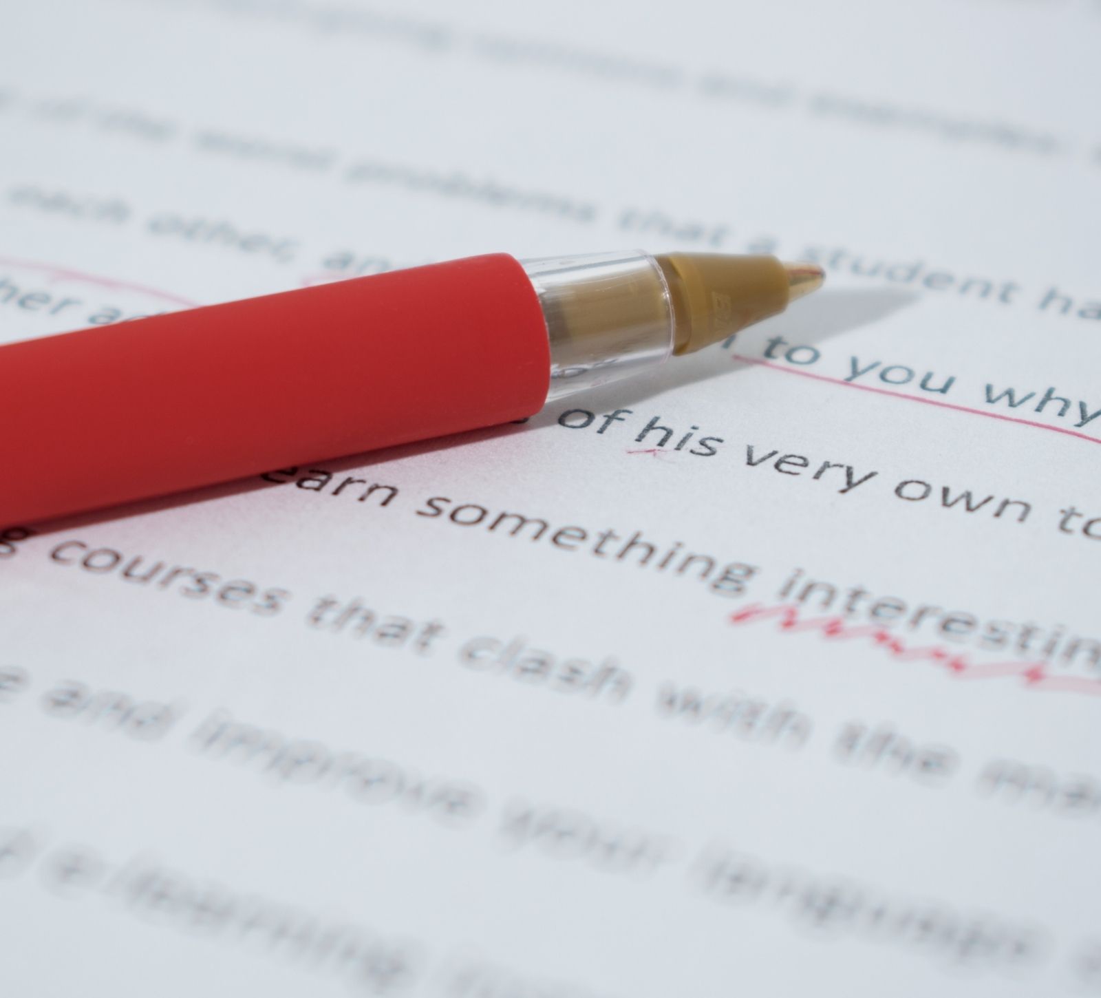 Kitchen Table CEOs Blog How To Use A Comma - 5 Ways- Red pen making edits on document